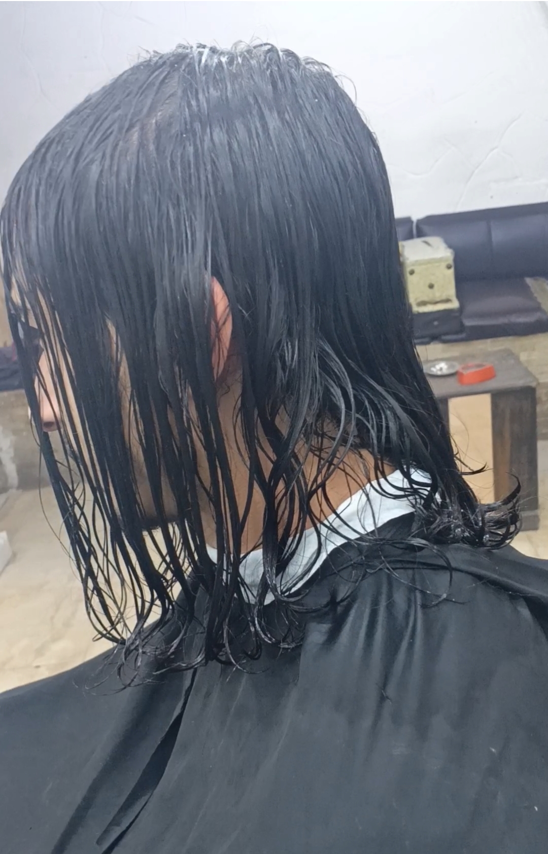 Client's hair being prepped before a cut